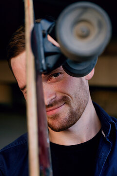 Handsome skater squinting eye at camera