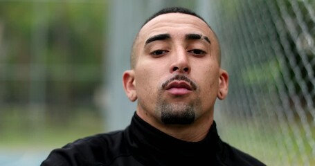 Hispanic man walking forward, south american latin guy serious face