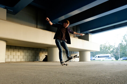 Man in casual clothes balancing on board