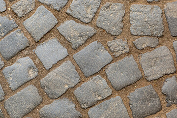 gray and weathered stone tile pattern used to create a city square