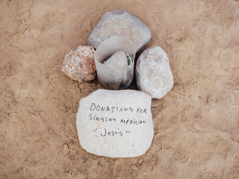 Donation jar for panhandler on the United States Mexico border