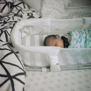 Baby sleeping in Basinet