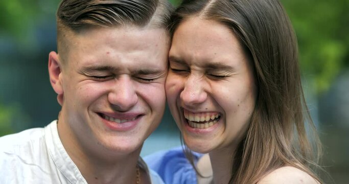 Close up portrait of happy couple looking at the camera and laughing feeling overjoyed looking at the camera. romantic relationship people in love portrait concept