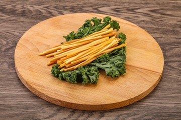 Chechel cheese sticks over board