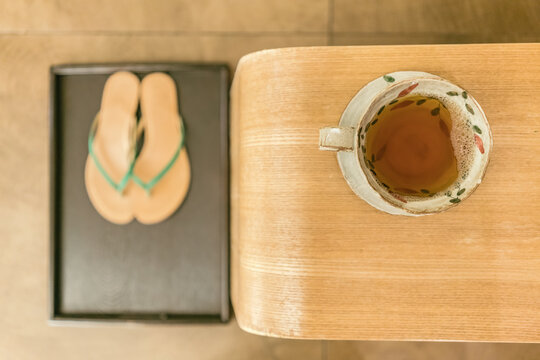 a cup of tea with flip flop