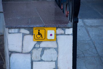 Button for calling staff to help people with disabilities and wheelchairs