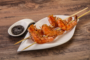 Grilled prawn skewer with pepper sauce