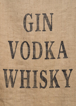 'Gin, vodka, whisky' lettering on hessian sackcloth