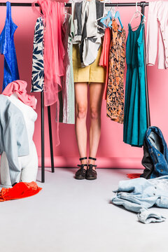 Unrecognizable woman standing in her wardrobe