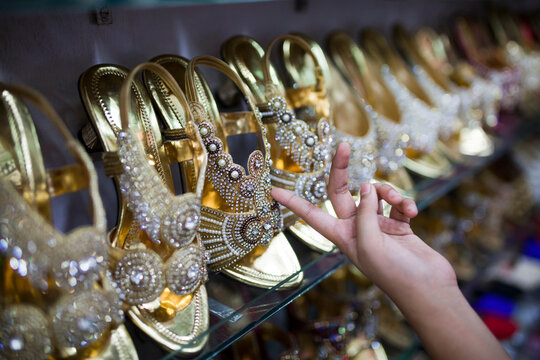 Decorated shoes in a row selling in a local market