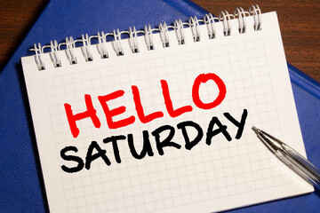 Hello Saturday Card with Blooming flower on wooden background © Uladzislau