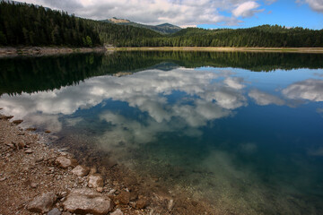 Mountain lake with beautiful clouds