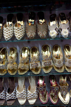Decorated shoes in a row selling in a local market