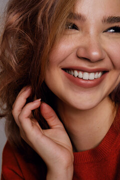 Cheerful young woman with beautiful smile in close-up.