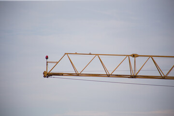 Tower crane at a construction site in the city