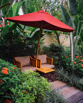Umbrellas and sofas in the garden