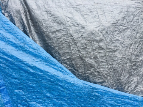 Blue and silver tarpaulin, close up