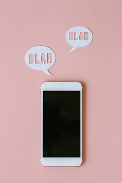 Phone and icons on pink background