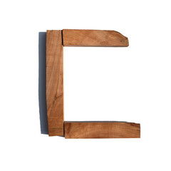 The letter C made of wood blocks on a white background board