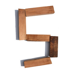 The letter S made of wood blocks on a white background board