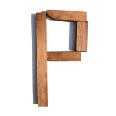 The letter P made of wood blocks on a white background board