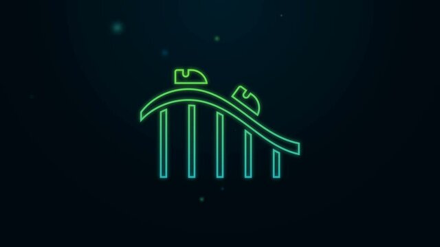 Glowing neon line Roller coaster icon isolated on black background. Amusement park. Childrens entertainment playground, recreation park. 4K Video motion graphic animation