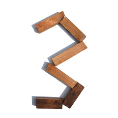 The number 3 is made of wood on a white background board