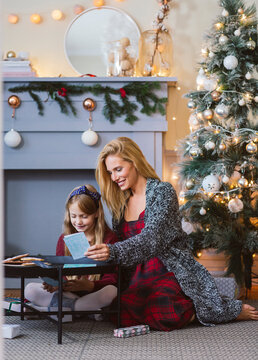 Mother and Daughter Prepering Christmas Presents
