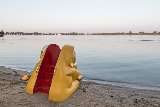 Yellow elephant slide on the shores of a lake in Masuria/ Poland