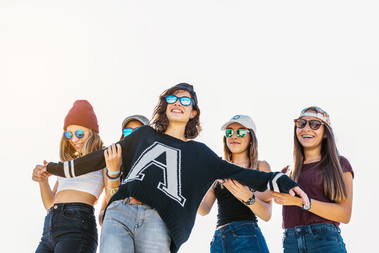 Five girls making ""Titanic"" pose.