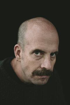 Portrait of pensive man with moustache
