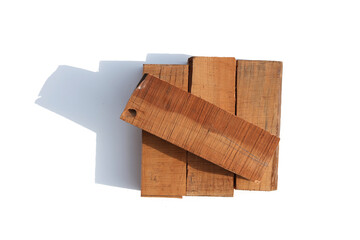 Four pieces of wood on a white background board