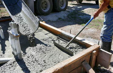 Concrete pouring during commercial concreting floors of  house foundation