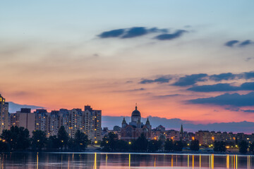 Bright night embankment on the banks of the Dnieper on Obolon