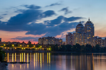 Bright night embankment on the banks of the Dnieper on Obolon