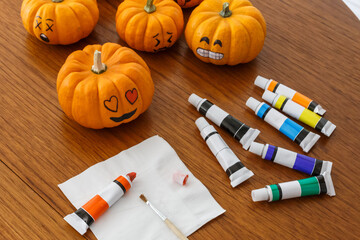 Painting emoticon faces on pumpkins