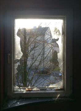 View at the road through the broken window