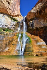 Lower Calf Creek Falls Waterfall colorful views from the hiking trail Grand Staircase Escalante National Monument between Boulder and Escalante in Southern Utah. United States.