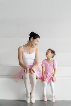 Teacher and littler girl at dancing classroom
