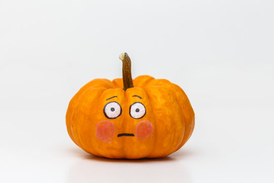 pumpkin with flushed emoticon face
