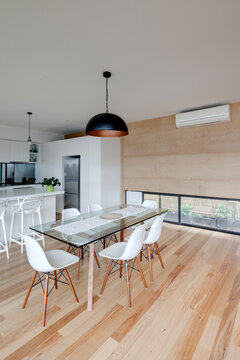 Dining area of home with rammed earth walls