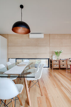Dining area of home with rammed earth walls