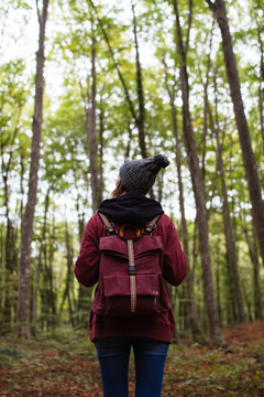 Woman in the forest with her backpack