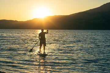 Paddle surf at sunset