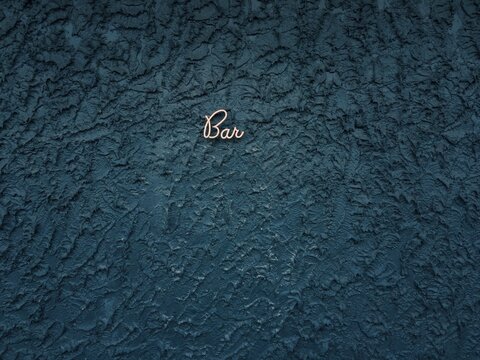 Beautiful 'Bar' Sign on Textured Wall