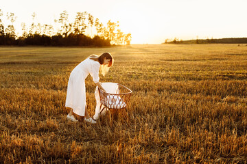 Beautiful woman with beautiful newborn baby girl at the field, loving mother take care of little daughter, tender family moments, parenting and maternity concept