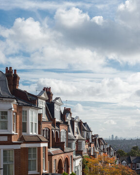 Brick houses of Muswell Hill and panorama of London with Canary Wharf, London, UK