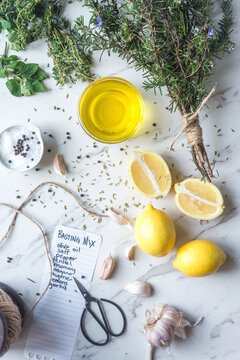 ingredients for a greek flavoured marinade, including lemon, oli