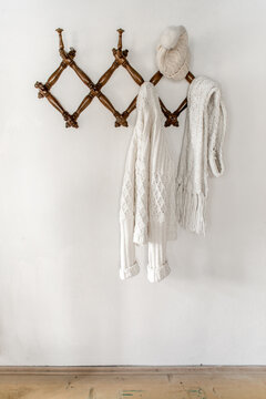 White warm clothing on wall hanger