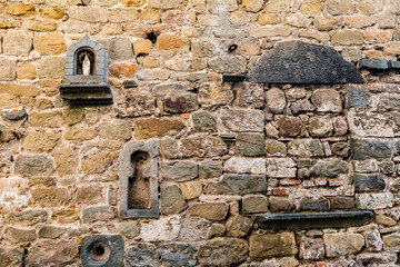 Stone wall with a laid window in Montecatini Alto, Tuscany, Italy